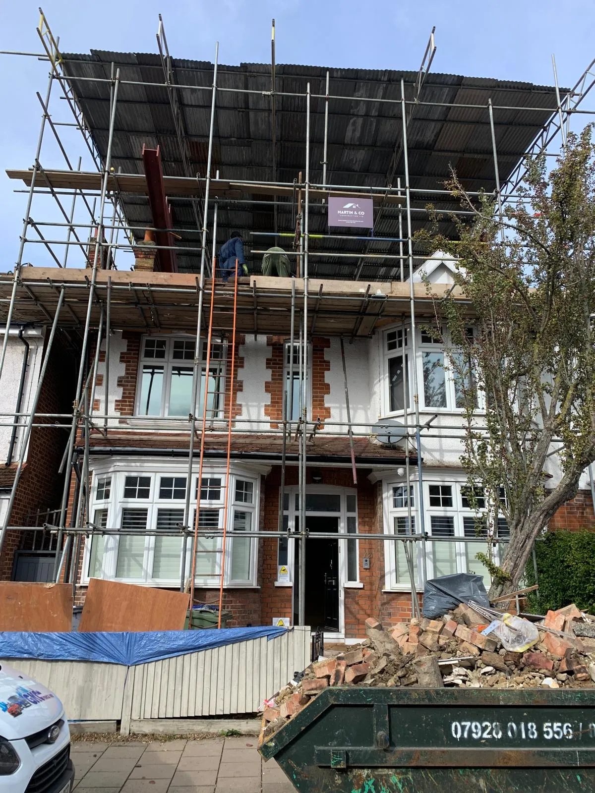 Loft conversion underway in Bath by Aspect Builds — scaffolded elevation with structural steelwork going in